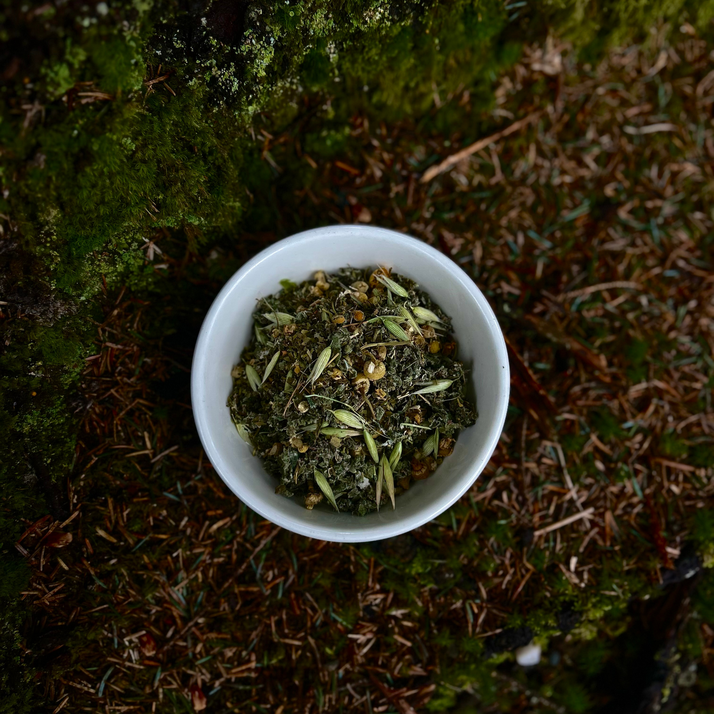 Loose-leaf herbal tea blend with red raspberry leaf, nettle, lemon balm, and eleuthero root for stress relief and nervous system support.